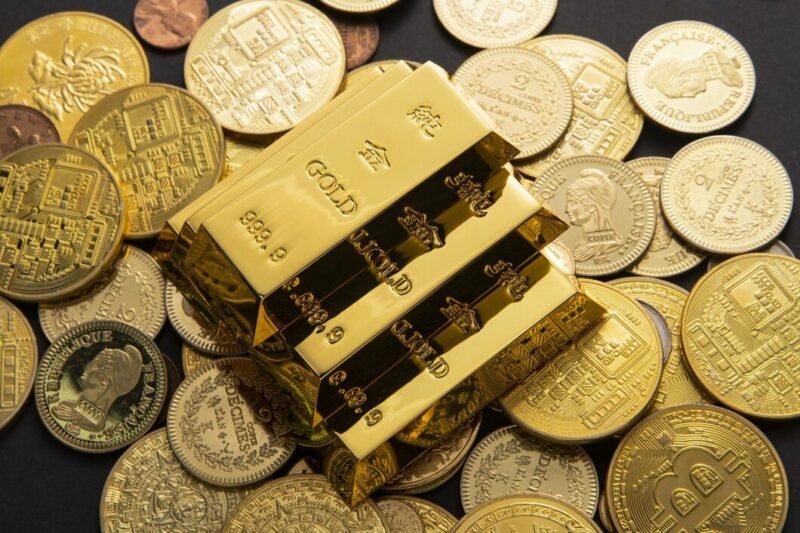 closeup shot pile shiny gold coins bars 181624 60854 Cronos Asia