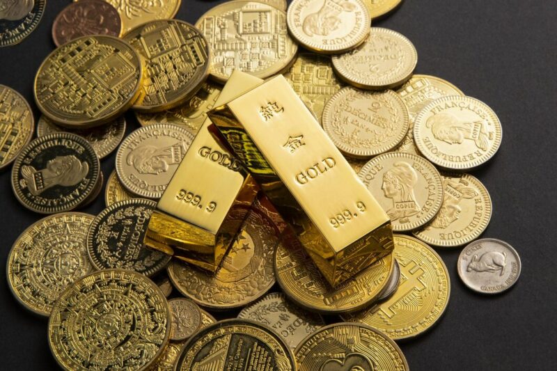 coins gold bars scattered table 181624 59753 Cronos Asia